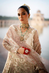 Drape yourself in the exquisite elegance of Dove, a masterpiece of timeless luxury. This opulent ensemble features a meticulously Resham embroidered and hand-embellished organza front, enriched with fine artistry on its right and left panels. The sleeves, adorned with intricate Resham and sequins embroidery, add a touch of regal grace, while matching motifs elevate the look with unparalleled sophistication. The back echoes the front's refined details, harmoniously paired with a 144-inch embroidered border t