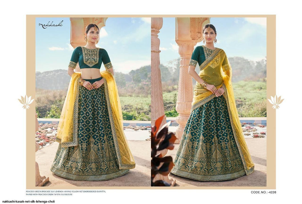 Buy Nakkashi Designer Lehenga | Nakkashi Kasak 4226 Peacock green color Indian wedding dresses online UK. We have elegant collection of Indian Wedding dresses online USA to choose from for Party & Wedding Wear. Shop now for Indian Designers UK online like Maisha, Ashirwad, Mohini are all available at Lebaasonline.co.uk